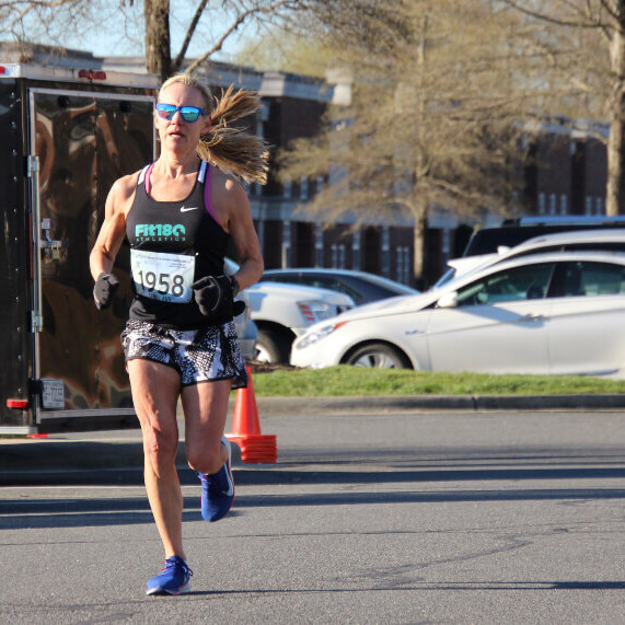 Caroll Ann running to the meet