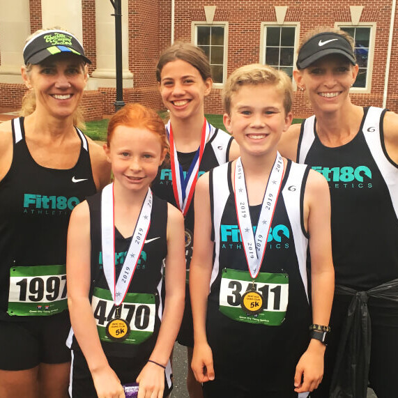 Caroll Ann taking photo-op with medal winners
