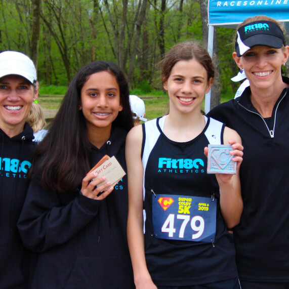 Caroll Ann taking a congratulations picture with winners