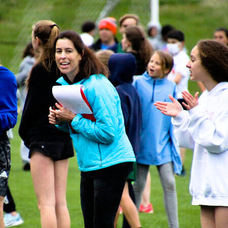 Coach Kimber happy congratulating the kids for their results