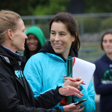 Coach Kimber talking to Coach Lisa