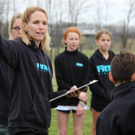 Coach Lisa instructing the kids
